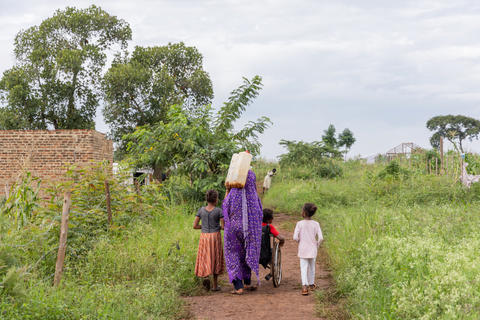 Maxada Ibrahim Ahmed, a mother of three, living in - Cluster L, Kiryandongo refugee settlement. 'I am grateful to the government of Uganda because they have given me a home .'  'When I arrived here in July, 2024, the  water was very far and it was difficult for me to go and get water for my child. Now it is very near. And I thank everyone who has given me the chance to get water quickly. And now my boy can also take water in the jerrycan on his wheel chair and bring it home